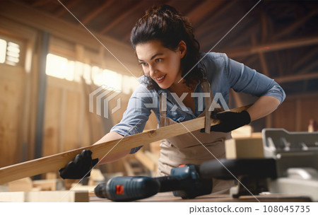 carpenter is working in workshop carpenter is working in workshop 108045735