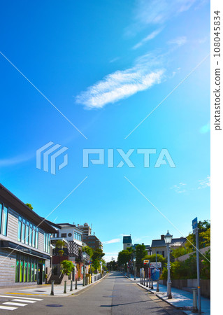 Stylish streetscape of Kobe Kitano - blue sky and green street trees Stylish streetscape of Kobe Kitano - blue sky and green street trees 108045834