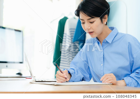 Self-employed woman working from home Self-employed woman working from home 108048345