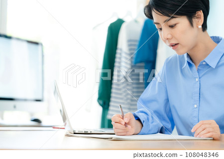 Self-employed woman working from home Self-employed woman working from home 108048346