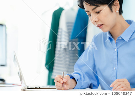 Self-employed woman working from home Self-employed woman working from home 108048347