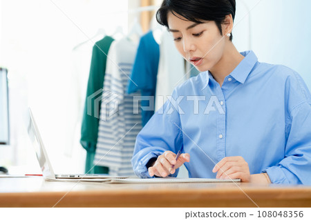 Self-employed woman working from home 108048356