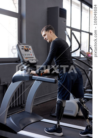 young active man with great willpower working out at sport center 108049884