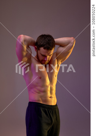 motivated ambitious young sportsman showing his perfect body motivated ambitious young sportsman showing his perfect body 108050224