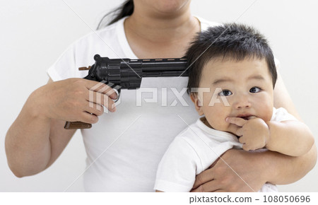 little boy with gun