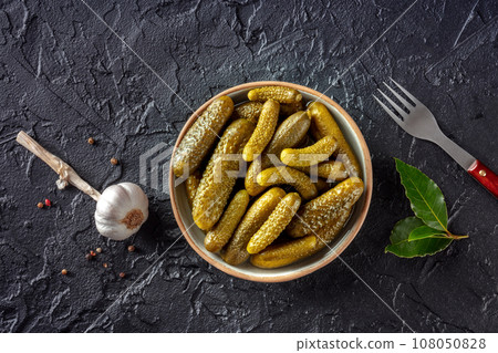 Pickled cucumbers with garlic and bay leaf. Fermented food 108050828