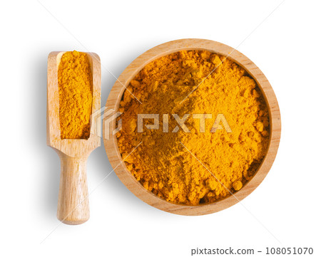 Turmeric powder pile in wood bowl and scoop isolated on white Turmeric powder pile in wood bowl and scoop isolated on white 108051070