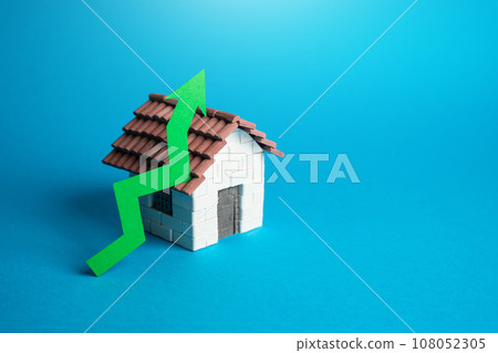 House and green arrow up. Rising housing prices. Profitability of investments, growth in the real estate market. Growing demand, construction rates and trends. House and green arrow up. Rising housing prices. Profitability of investments, growth in the real estate market. Growing demand, construction rates and trends. 108052305