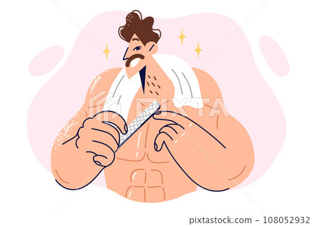 Man uses nail file to care for hands or cuticles standing with torso bare and towel around neck Man uses nail file to care for hands or cuticles standing with torso bare and towel around neck 108052932