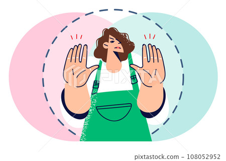 Woman demonstrates personal boundaries and asks not to approach, showing palms of two hands 108052952