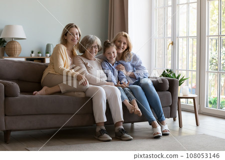 Happy girls and women of four different generations resting close 108053146