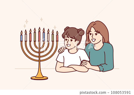 Preteen girls sisters look at menorah with burning candles and rejoice at approach holiday hanukkah Preteen girls sisters look at menorah with burning candles and rejoice at approach holiday hanukkah 108053591