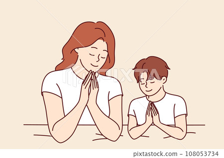 Mom prays with son before bed, asking god to teaching child to religious lifestyle 108053734