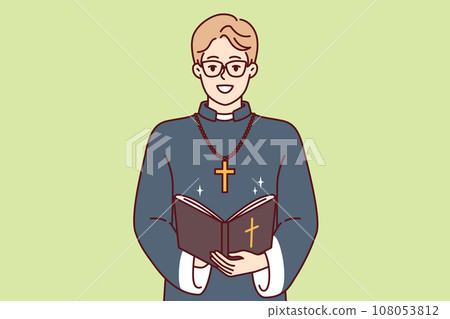 Happy man priest with bible and golden cross on neck smiles preaching and reading christian prayers Happy man priest with bible and golden cross on neck smiles preaching and reading christian prayers 108053812