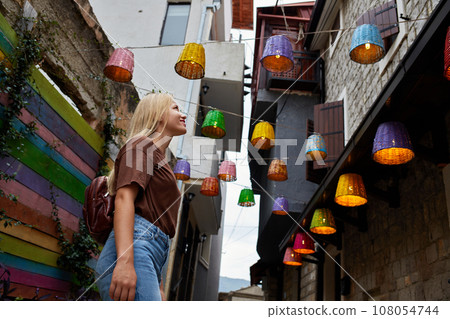 A young girl travels through the old town of Bar, Montenegro. A young girl travels through the old town of Bar, Montenegro. 108054744