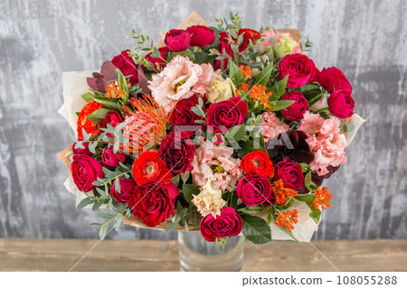 Small Beautiful bouquet of mixed flowers in vase. Floral shop concept . Beautiful fresh cut bouquet. Flowers delivery Small Beautiful bouquet of mixed flowers in vase. Floral shop concept . Beautiful fresh cut bouquet. Flowers delivery 108055288