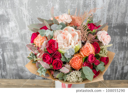 Floral shop concept. Small Beautiful bouquet of mixed flowers. Beautiful fresh cut bouquet. Flowers delivery Floral shop concept. Small Beautiful bouquet of mixed flowers. Beautiful fresh cut bouquet. Flowers delivery 108055290