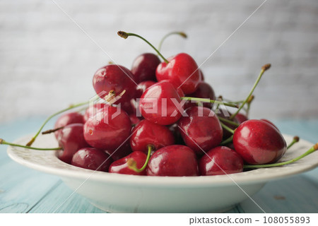 ripe fresh cherry in a bowl on table ripe fresh cherry in a bowl on table 108055893