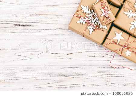 Christmas wooden background with gift boxes and decor. Top view with copy space for your text. Toned 108055926