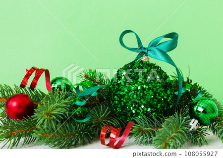 New Year Christmas tree toy, branches of a christmas tree, New Year decorations on a colored background New Year Christmas tree toy, branches of a christmas tree, New Year decorations on a colored background 108055927
