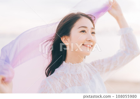 Woman portrait on sunset background Woman portrait on sunset background 108055980