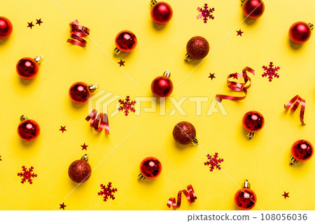 Christmas composition. a pattern of christmas balls on colored background. Flat lay, top view New year decor Christmas composition. a pattern of christmas balls on colored background. Flat lay, top view New year decor 108056036