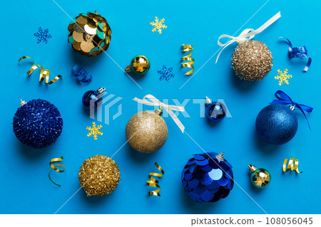 Christmas ball on colored background. decoration bauble with ribbon bow with copy space 108056045
