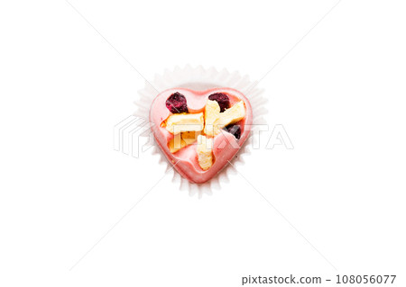 top view of chocolate pralines in heart form isolated on white background 108056077