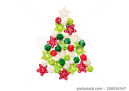 Isolated Christmas tree made from colored handmade ball decoration on colored background, view from above. New Year minimal concept 108056347