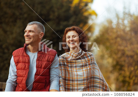 smiling romantic family in park walking smiling romantic family in park walking 108056824