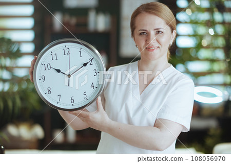 Portrait of smiling massage therapist woman in massage cabinet 108056970