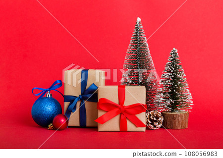 Christmas composition. Gifts, small tree, branches and craft DIY decorations on white background. New year concept. Christmas home decoration Flat lay, top view, copy space 108056983