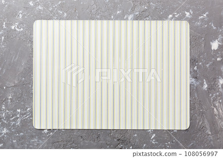 Top view of light tablecloth for food on cement background. Empty space for your design Top view of light tablecloth for food on cement background. Empty space for your design 108056997