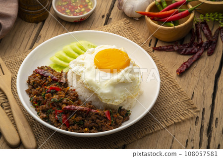 Thai Basil Minced beef,Stir fired ground beef with garlic and basil leaf in chilli sauce with Cooked rice topped with fried egg (Pad Kra pao) 108057581