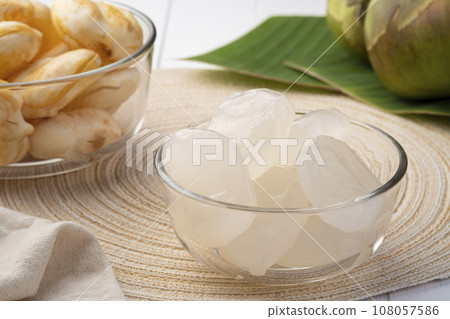 Fresh toddy palm,Peeled Palmyra palm fruits in glass bowl,Asian tropical healthy refreshment fruit. Fresh toddy palm,Peeled Palmyra palm fruits in glass bowl,Asian tropical healthy refreshment fruit. 108057586