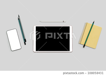 Tablet and phone with isolated screen, notepad, pencils lying on table. Mockup. Tablet and phone with isolated screen, notepad, pencils lying on table. Mockup. 108058431