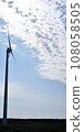 Wind turbine and flowing white clouds vertically [Photo location: Horonobe Town, Hokkaido] 108058505