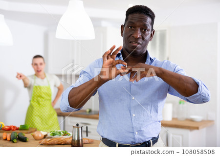 Husband defiantly removes wedding ring from his finger Husband defiantly removes wedding ring from his finger 108058508