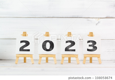 Upcoming 2023 New Year with Art Board over white wood background. Upcoming 2023 New Year with Art Board over white wood background. 108058674