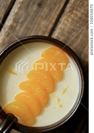 Yogurt jelly decorated with mandarin oranges served on Japanese tableware Yogurt jelly decorated with mandarin oranges served on Japanese tableware 108058870