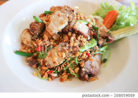 pork noodles or deep fried pork , fried pork or stir fried pork 108059089