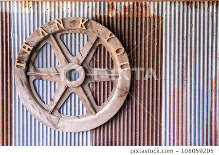 Thank you sigh wheel on rusty metal sheet texture background Thank you sigh wheel on rusty metal sheet texture background 108059205