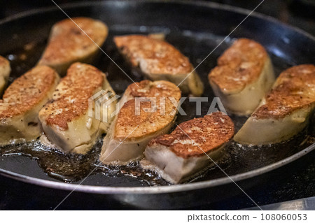 Cooking foie gras over pan 108060053