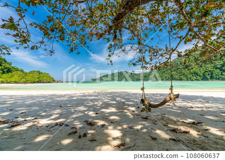 Wooden swing on beautiful white sand beach, Surin island national park, Phang nga, Thailand 108060637