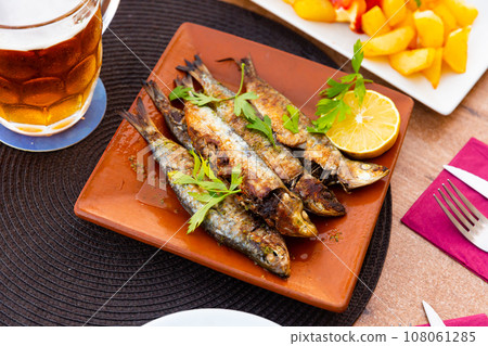 Fried sardines served with slice of lemon 108061285