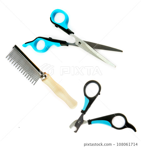 Scissors, claw cutter and comb for grooming dogs isolated on white . Collage. Scissors, claw cutter and comb for grooming dogs isolated on white . Collage. 108061714