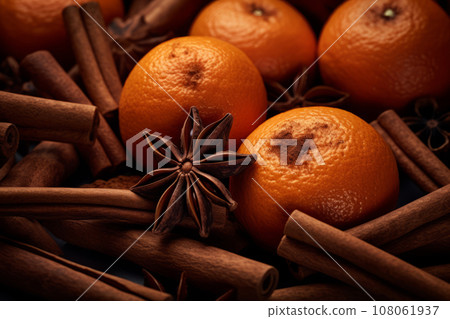 Cinnamon sticks, cloves, anise stars and citrus on dark background. Generative AI 108061937