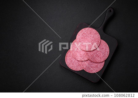 Delicious smoked salami sausage with salt, spices and herbs Delicious smoked salami sausage with salt, spices and herbs 108062812