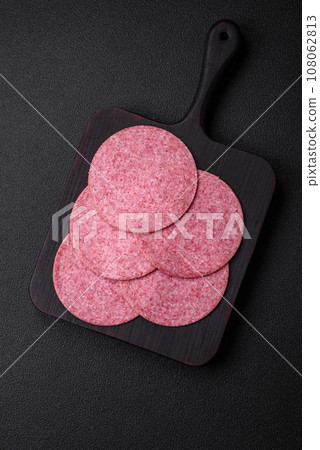 Delicious smoked salami sausage with salt, spices and herbs Delicious smoked salami sausage with salt, spices and herbs 108062813