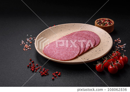 Delicious smoked salami sausage with salt, spices and herbs Delicious smoked salami sausage with salt, spices and herbs 108062836